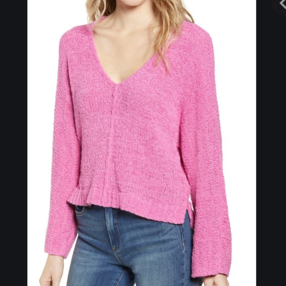 a pink sweater